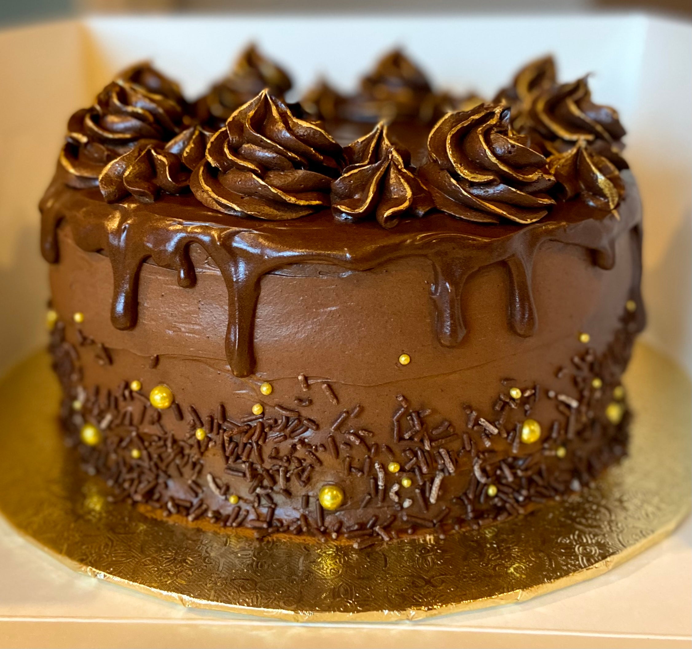 Chocolate fudge cake with gold accents